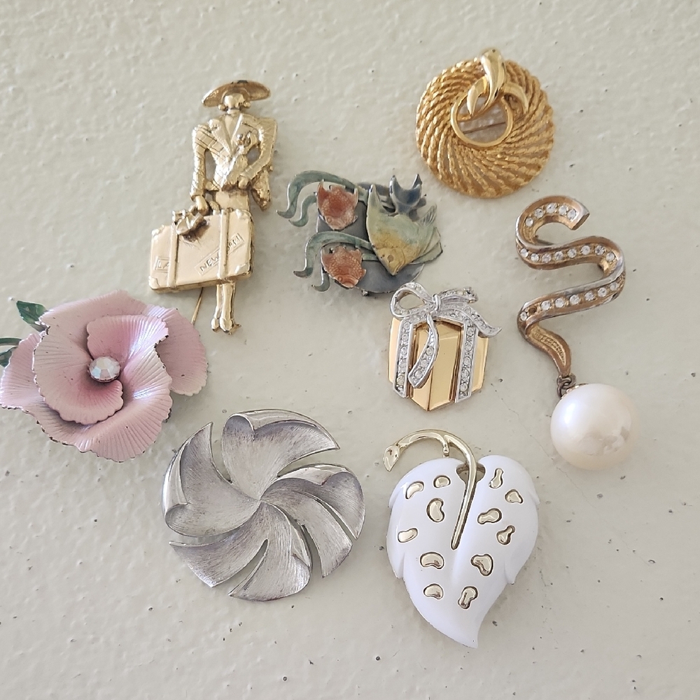 Elegant Gold and Silver Brooches